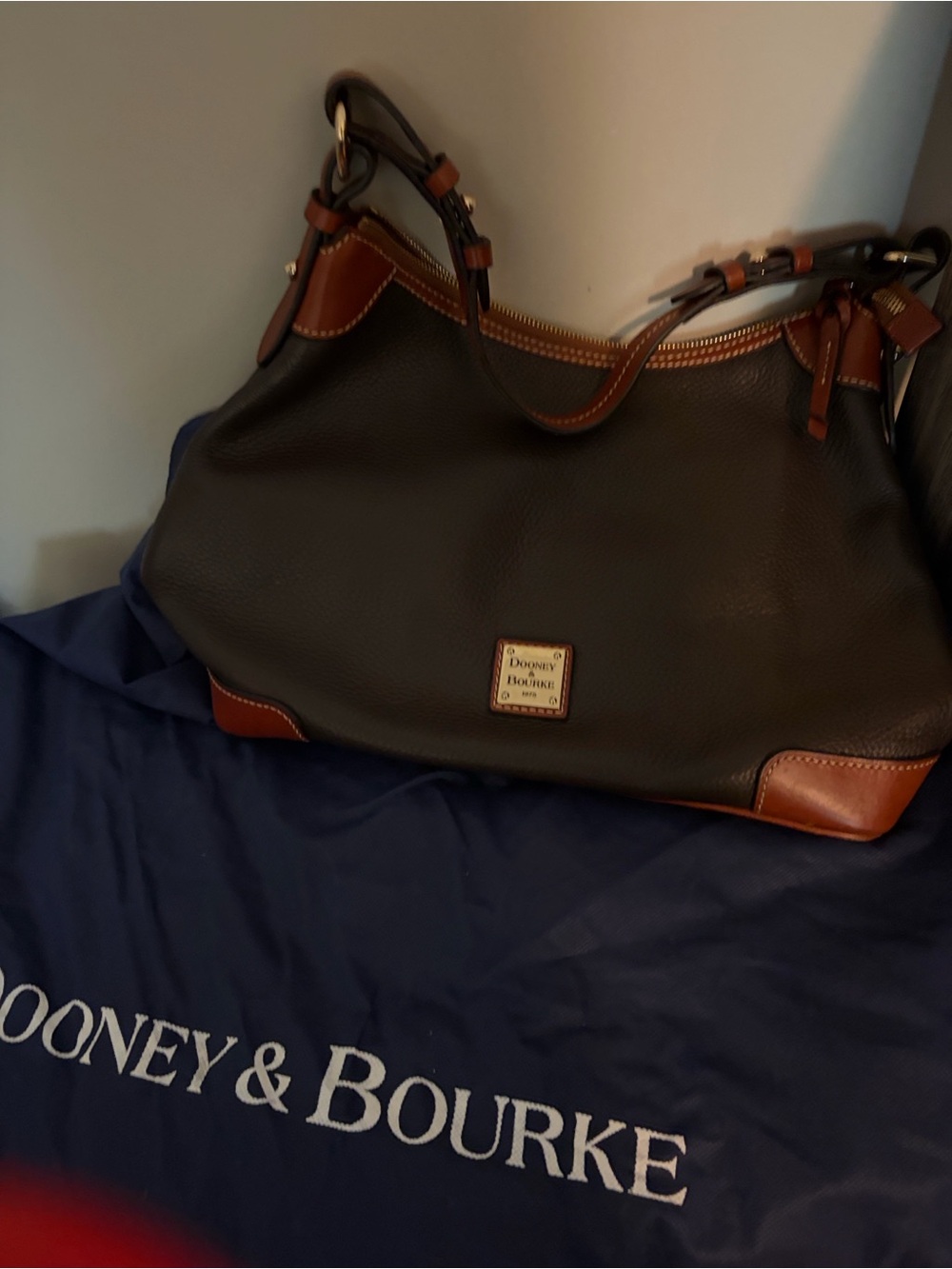 Dooney & Bourke Black Leather Messenger Bag with Brown Trim